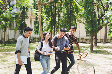 Vietnamese students walking through campus