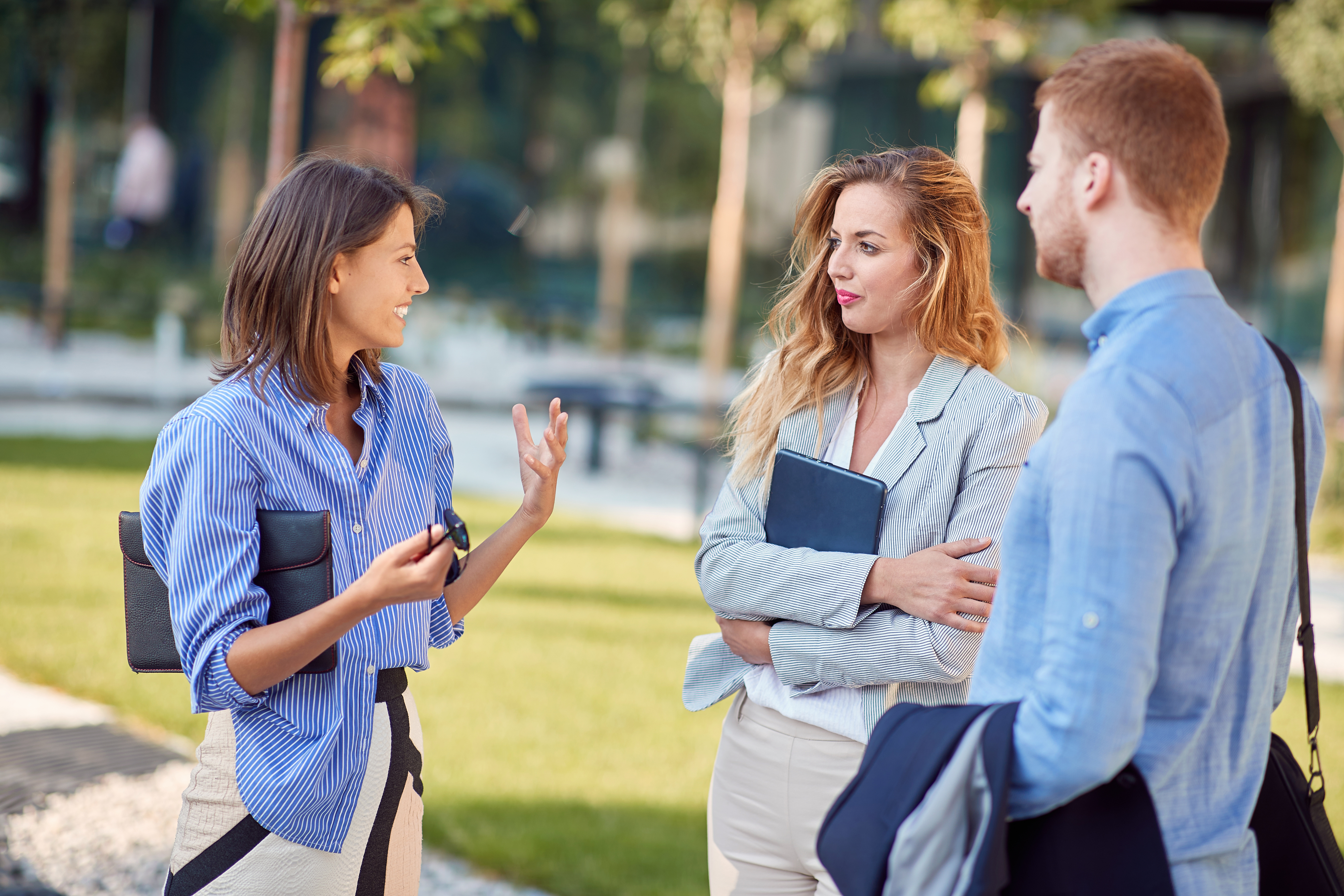 three people talking